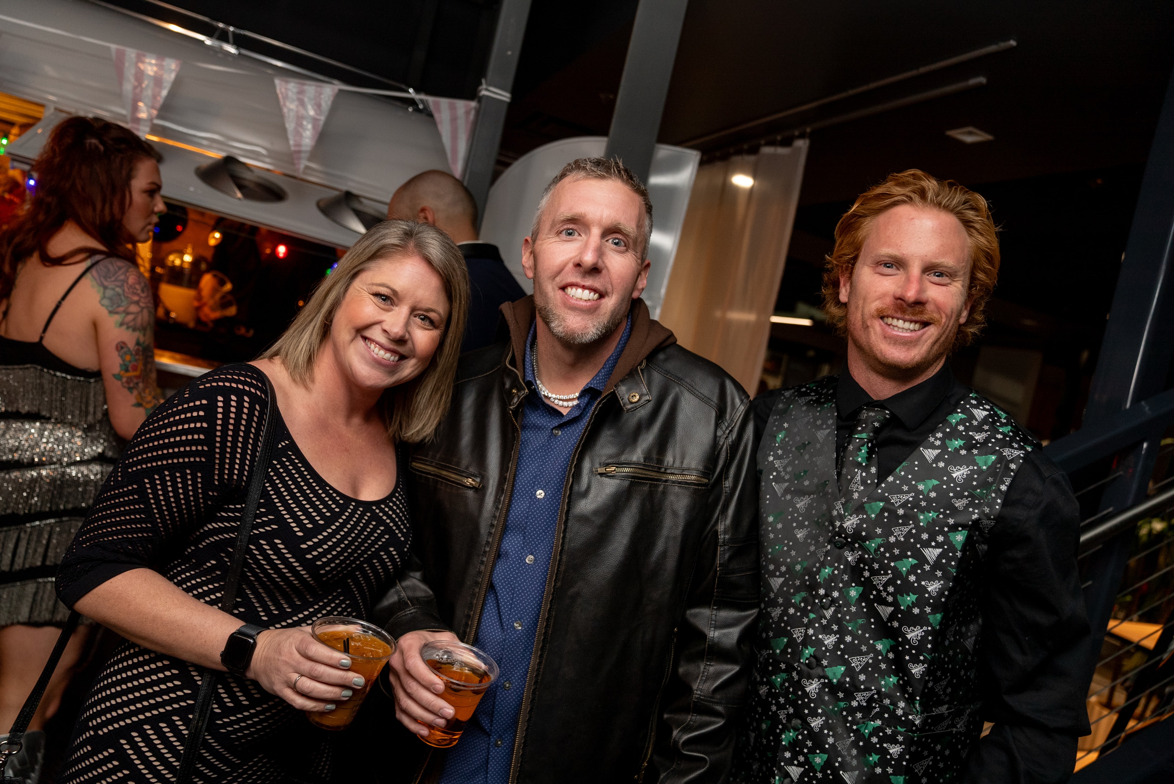 Friends at the nighttime rooftop party